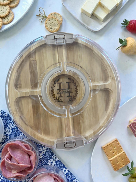 Round bamboo snack tray with engraved monogram and clear locking lid