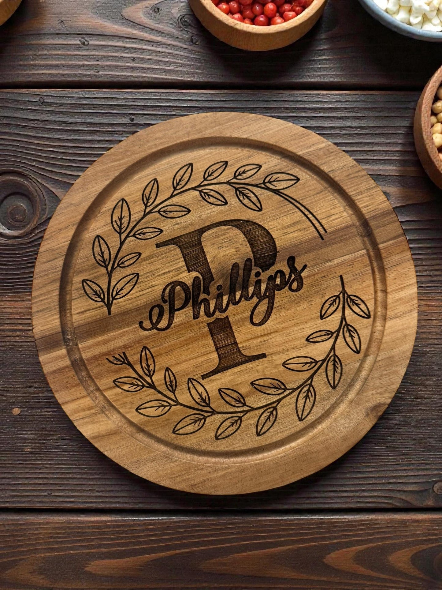 “Engraved acacia wood charcuterie board used for cheese and snacks”