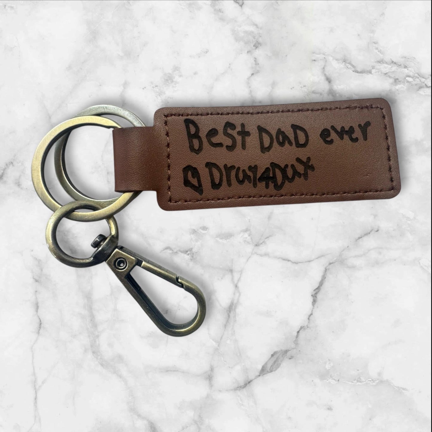 “Personalized leather keychain with engraved love note”